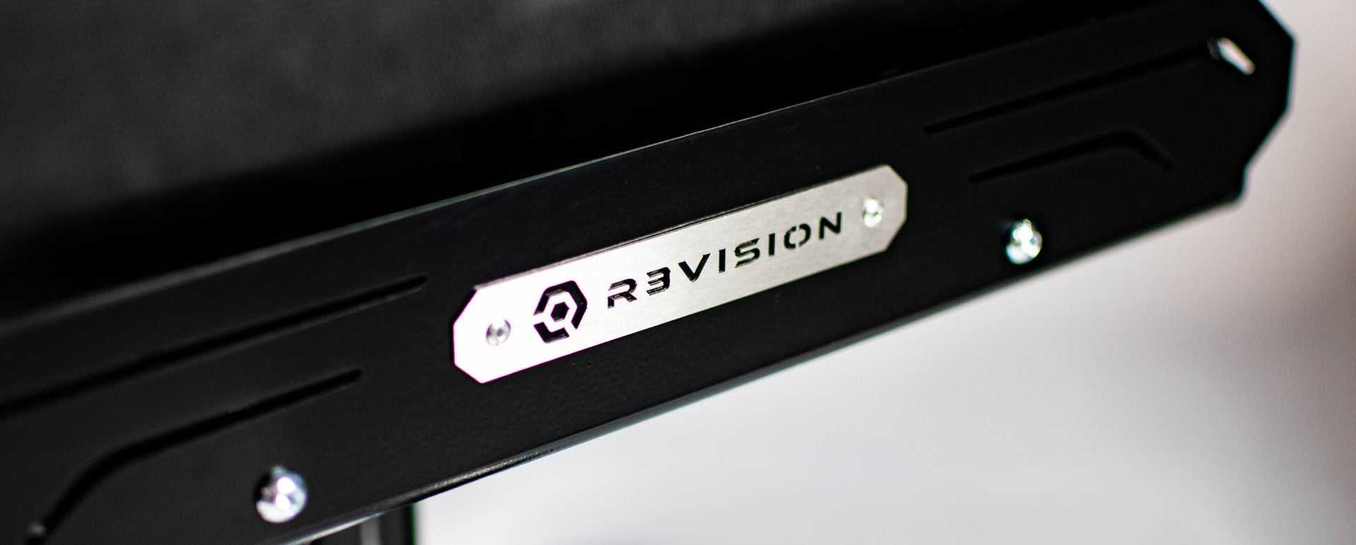 R3VISION Logo Plaque fixed to chair